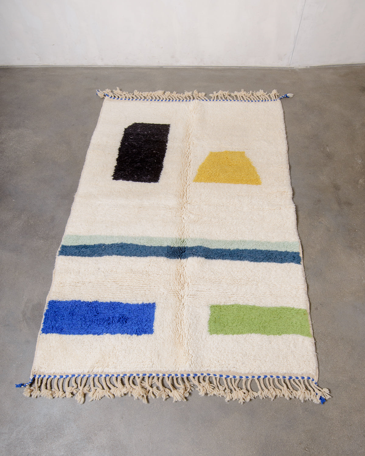 Modern, designer, handcrafted Berber rug from Morocco. Beniourain carpet with beautiful colours and patterns and fluffy wool texture.